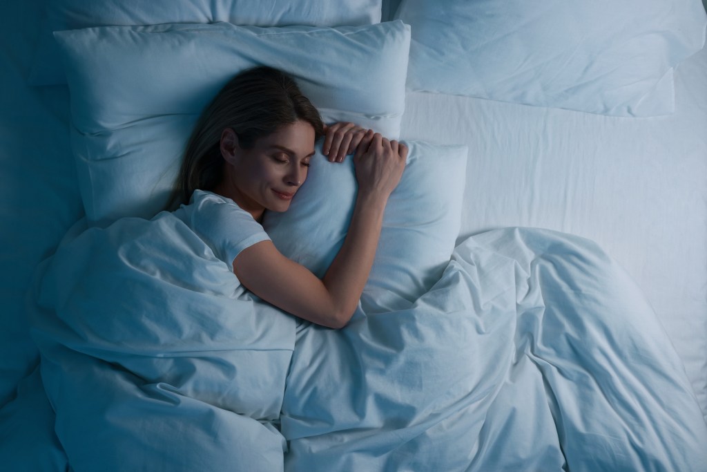 Over the look of a woman who sleeps in bed at night