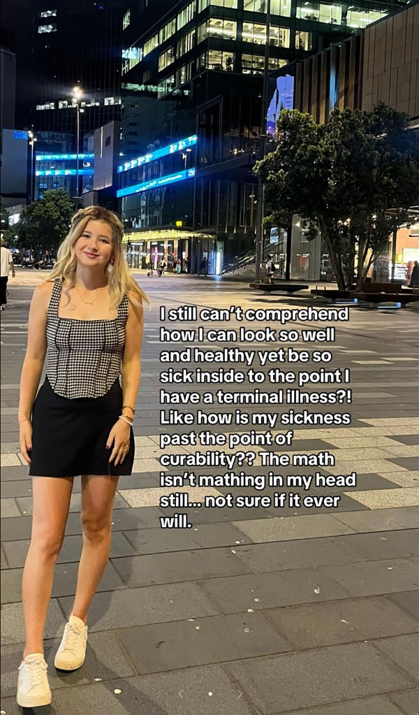 Dominique mcshaine stands on the street in happy photos.