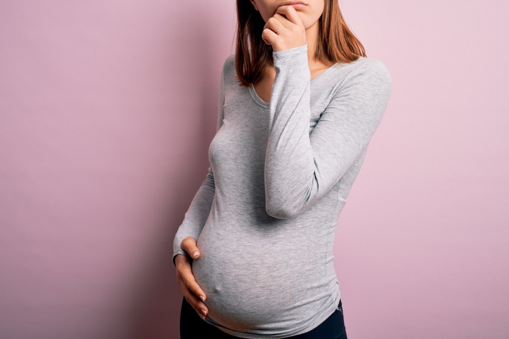 A young woman shows her baby's clash.