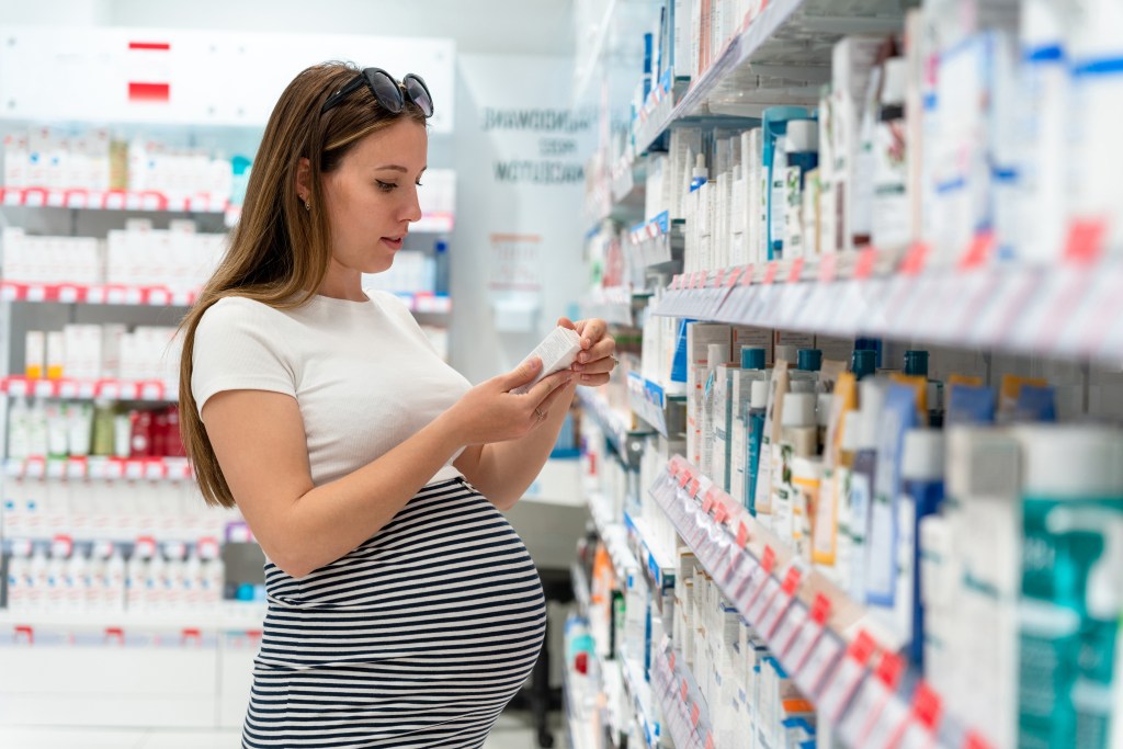 Pregnant woman at the pharmacy