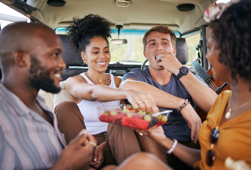 Grapes are a good source of fiber, vitamins, minerals and phytochemicals, with possible health benefits for the heart, kidneys, eyes, skin and gastrointestinal system. Here, friends eat grapes during a road trip.