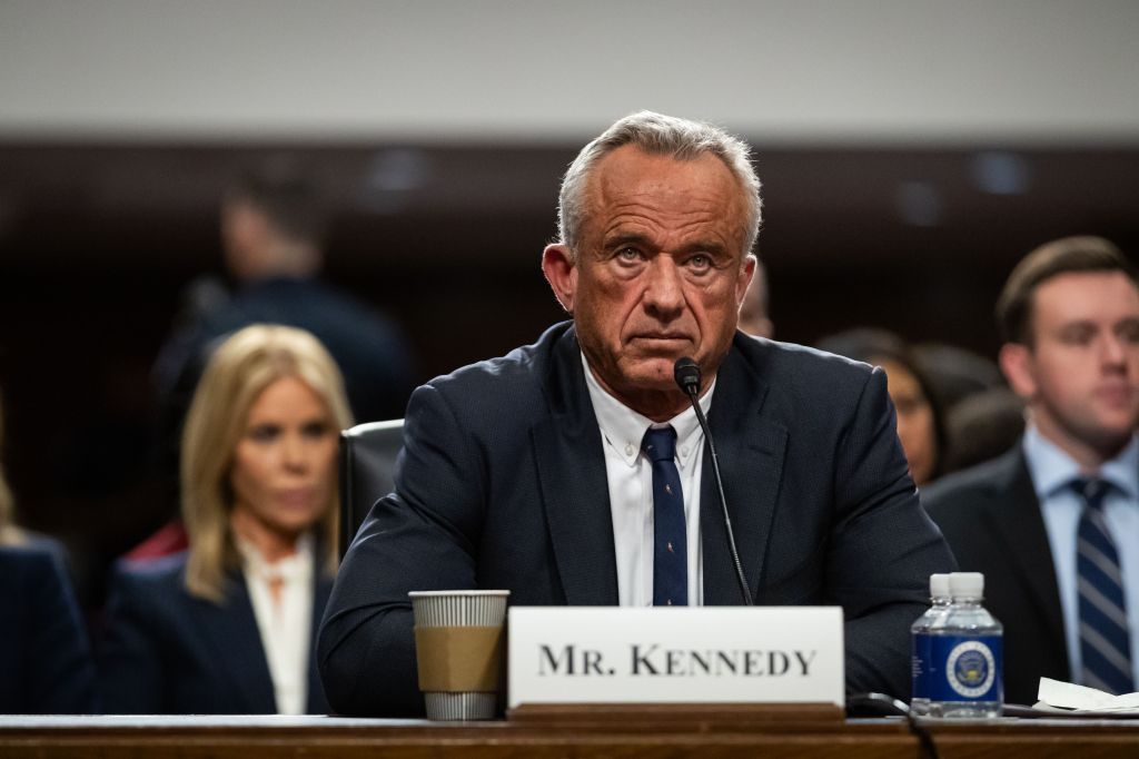 Robert F. Kennedy Jr., sitting at a table while hearing the confirmation of the Senate Finance Committee as nominated to lead health and human services, January 2025.