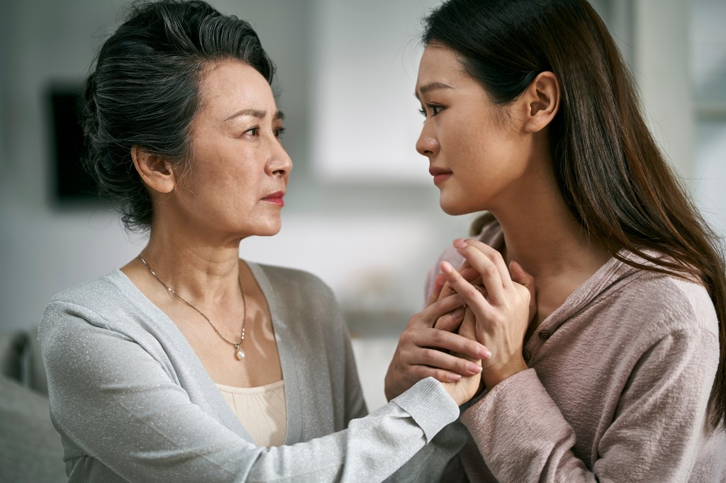 Young woman who comforts the mother with madness