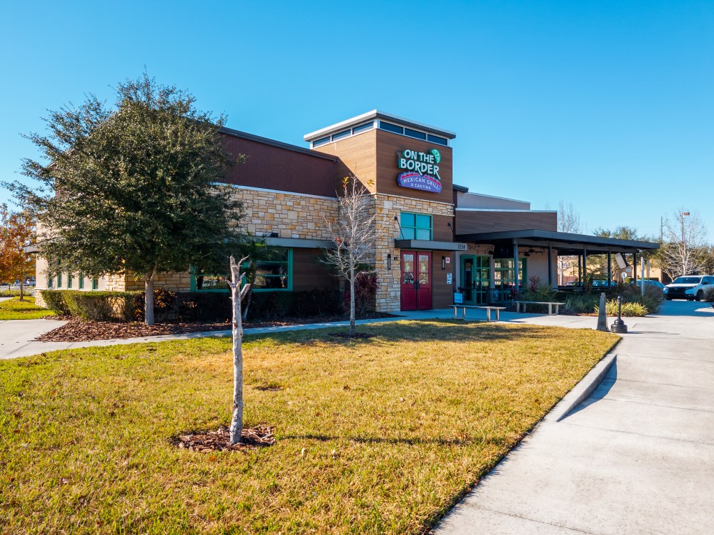 The wide horizontal view of the restaurant building with exterior Mexican grill.