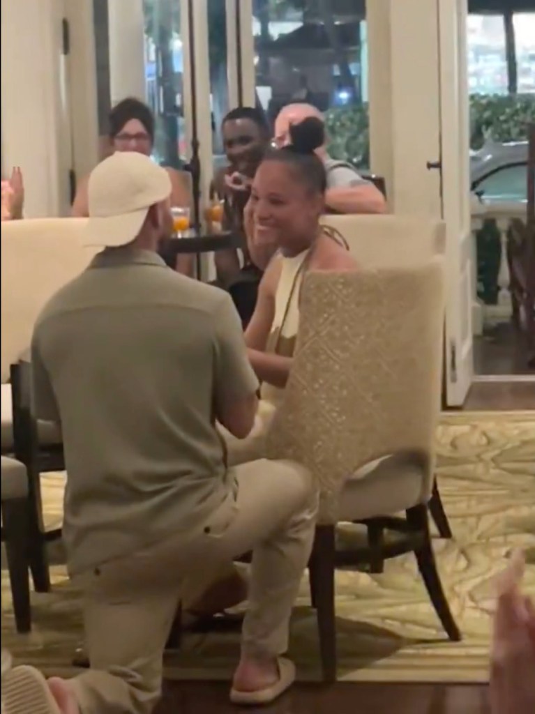 False man-proposals for woman at restaurant to get free drinks, stirring fierce debate